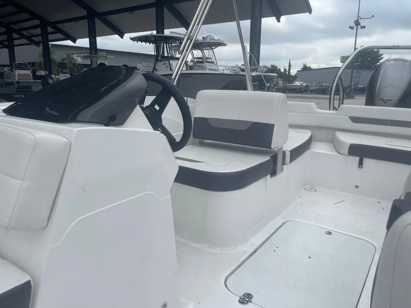 Slide: The Image of 2022 Hurricane SS185 OB boat interior with white and black seating. - 15