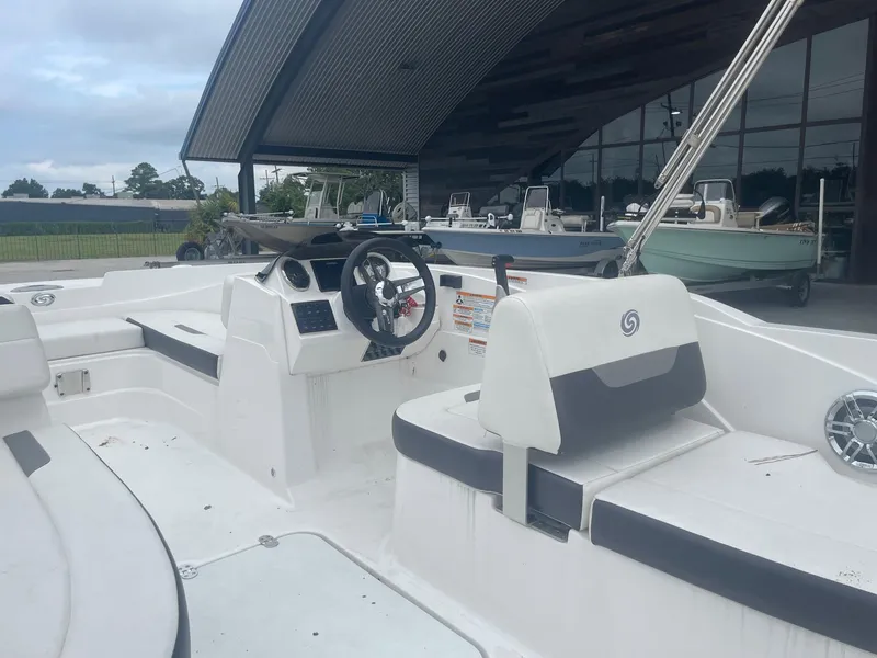 Slide: The Image of 2022 Hurricane SS185 OB boat interior with steering wheel and seating. - 17