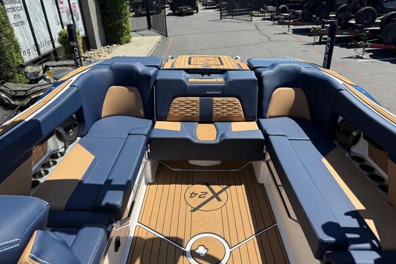 Slide: The Image of Luxurious interior of 2024 MasterCraft X24 boat with blue and tan seating. - 20