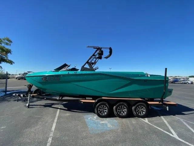 Slide: The Image of 2022 Axis Wake Research T250 boat on trailer in parking lot. - 6