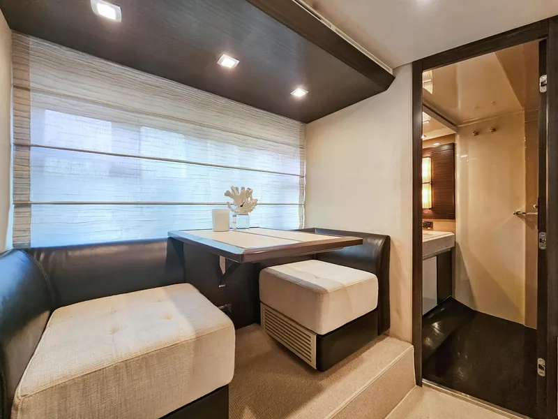 Slide: The Image of Interior dining area of 2013 Azimut 70 yacht with modern seating and decor. - 10