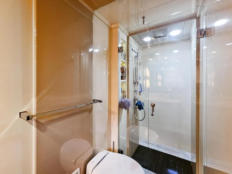 Slide: The Image of Luxurious bathroom on a 2013 Azimut 70 yacht with glass shower enclosure. - 13