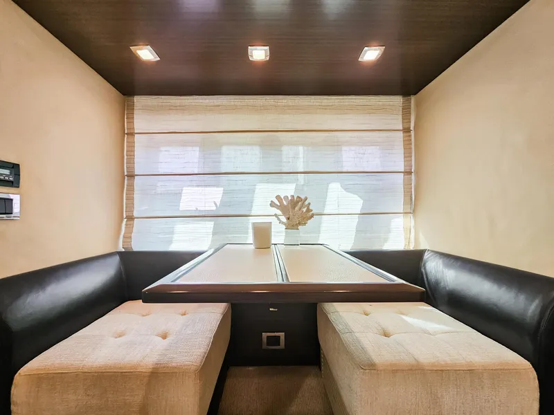 Slide: The Image of Luxurious dining area inside a 2013 Azimut 70 yacht with modern decor. - 15