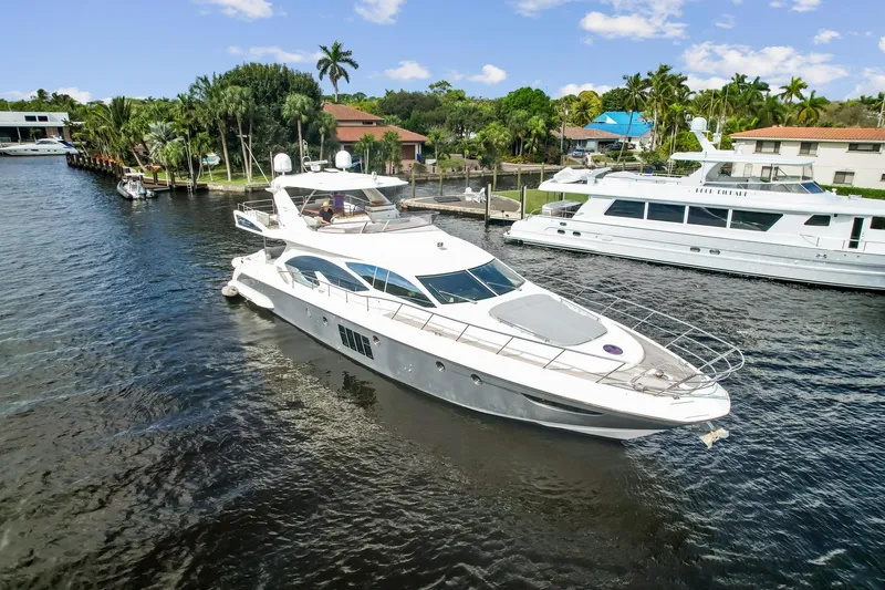 Slide: The Image of 2013 Azimut 70 yacht cruising in a scenic waterway. - 28