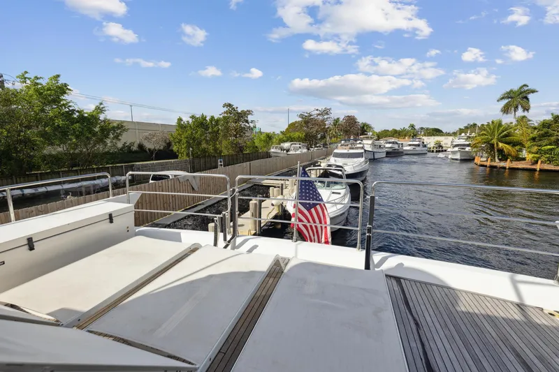 Slide: The Image of View from 2013 Azimut 70 yacht, docked in a marina with other boats. - 44