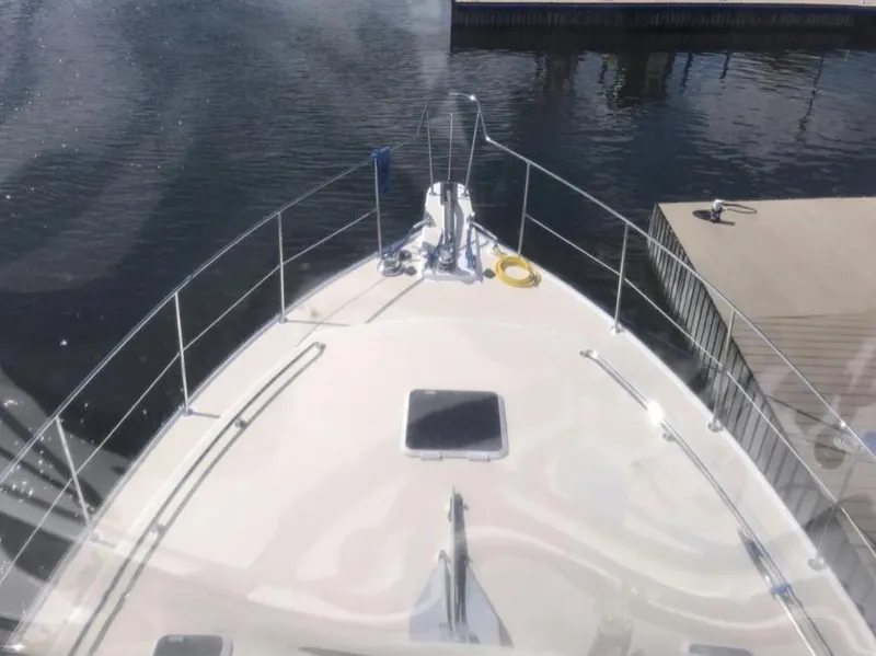 Slide: The Image of 2007 Duffy Aft Cabin boat docked, viewed from the bow. - 11