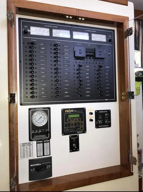 Slide: The Image of Electrical panel on a 2007 Duffy Aft Cabin boat, featuring various controls and gauges. - 21