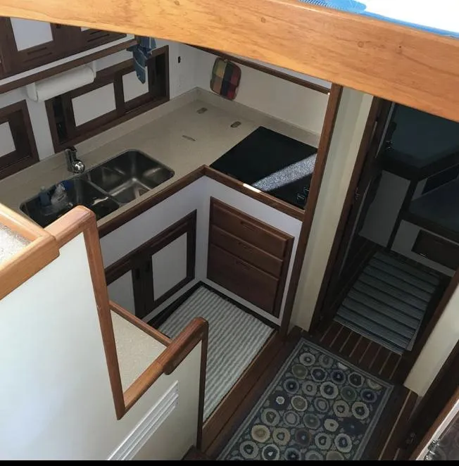 Slide: The Image of 2007 Duffy Aft Cabin kitchen with wood accents and modern amenities. - 22