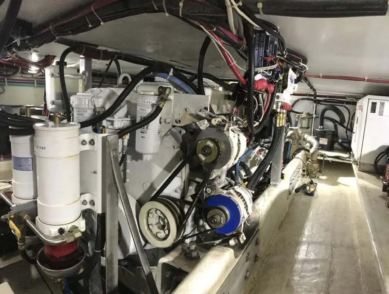 Slide: The Image of Engine room of 2007 Duffy Aft Cabin boat with visible machinery and wiring. - 32