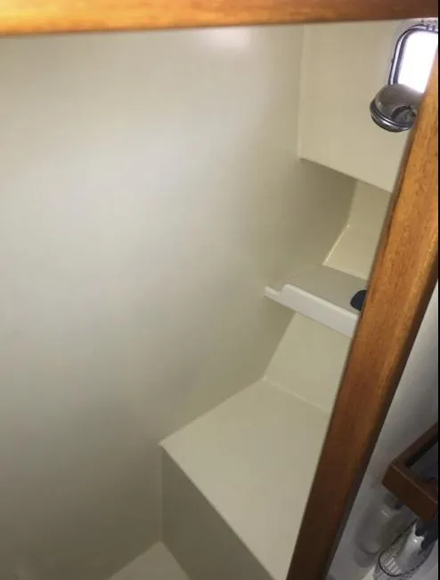 Slide: The Image of 2007 Duffy Aft Cabin interior with wooden trim and built-in shelving. - 35