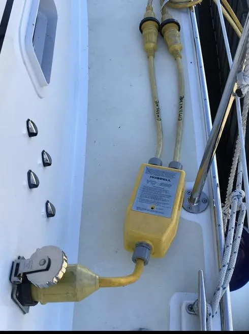 Slide: The Image of Yellow power cables on a 2007 Duffy Aft Cabin boat deck. - 5