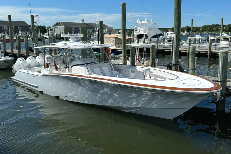Slide: The Image of 2025 Mag Bay 43 CC boat docked at a marina. - 18