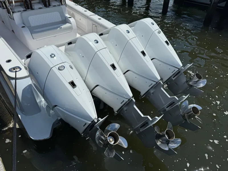 Slide: The Image of 2025 Mag Bay 43 CC boat with four powerful outboard engines. - 22