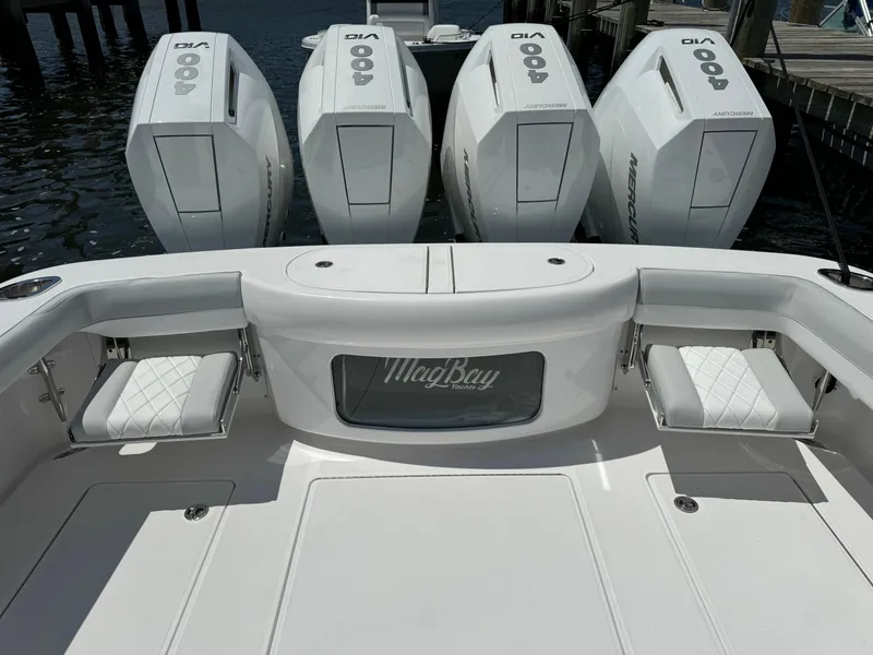Slide: The Image of 2025 Mag Bay 43 CC boat with quad outboard engines. - 25