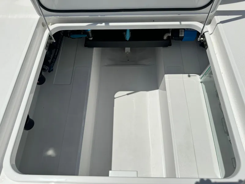 Slide: The Image of 2025 Mag Bay 43 CC boat storage compartment with open hatch. - 27