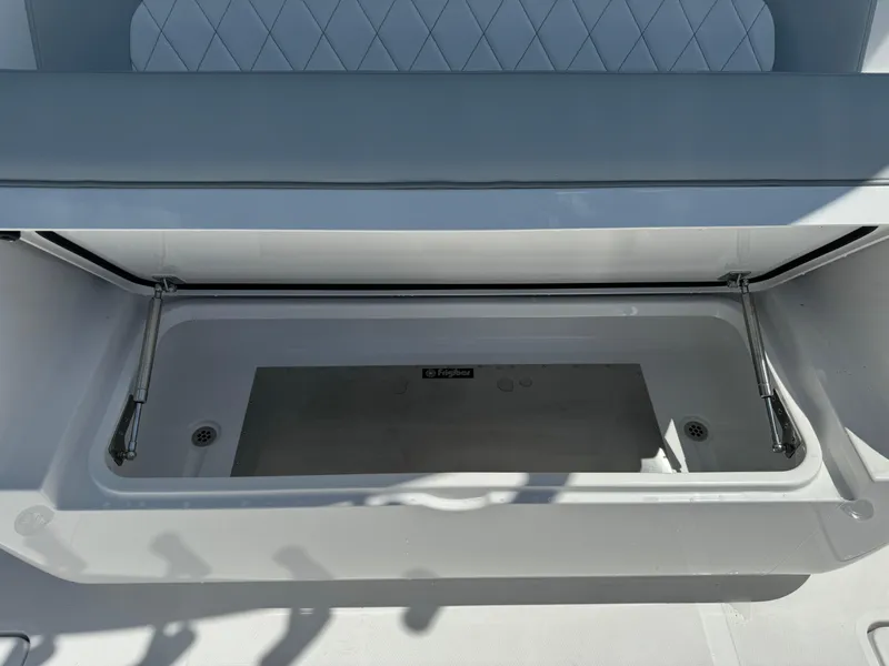 Slide: The Image of Open storage compartment on 2025 Mag Bay 43 CC boat. - 35