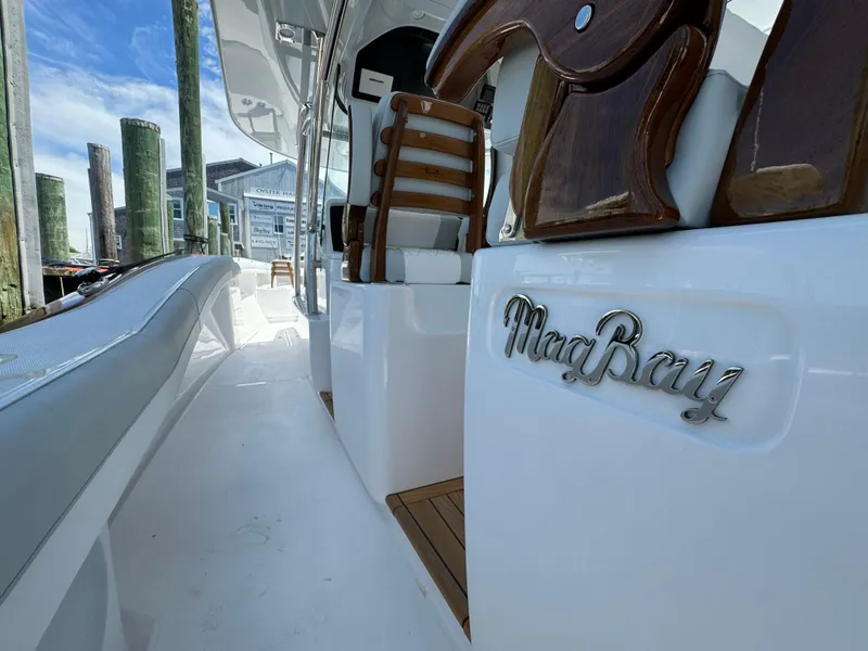Slide: The Image of 2025 Mag Bay 43 CC boat docked, showcasing sleek design and luxurious seating. - 40