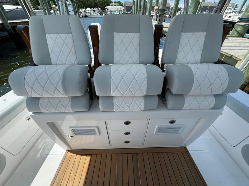 Slide: The Image of 2025 Mag Bay 43 CC boat with luxurious seating and storage compartments. - 41