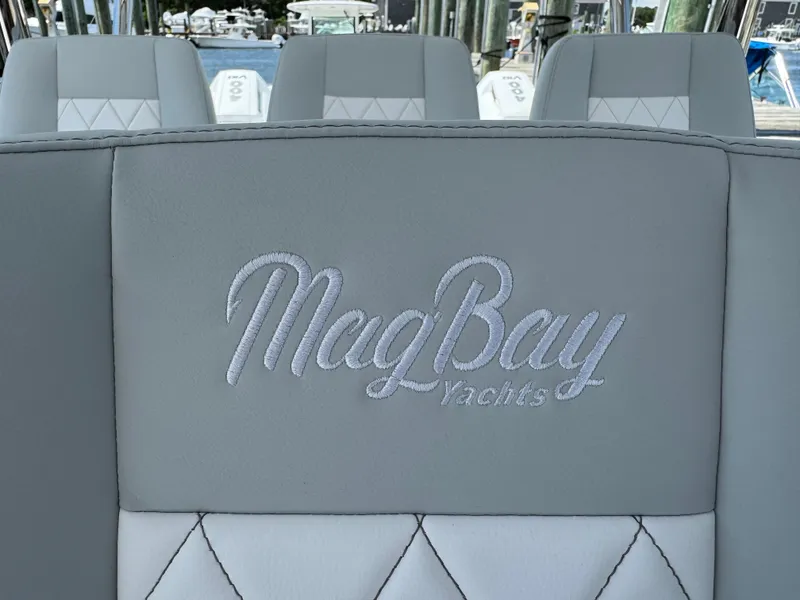 Slide: The Image of Mag Bay Yachts 43 CC 2025 model, luxury boat seating detail. - 48