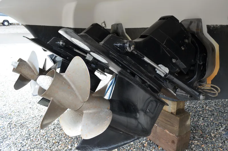 Slide: The Image of Close-up of 2013 Four Winns H310 boat propellers and outdrive system. - 11