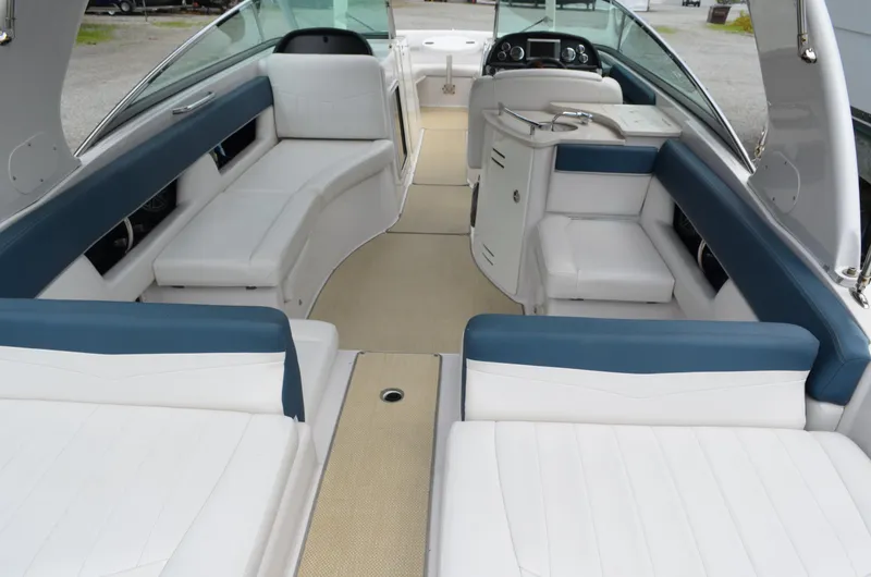 Slide: The Image of Interior of 2013 Four Winns H310 boat with white and blue seating. - 15