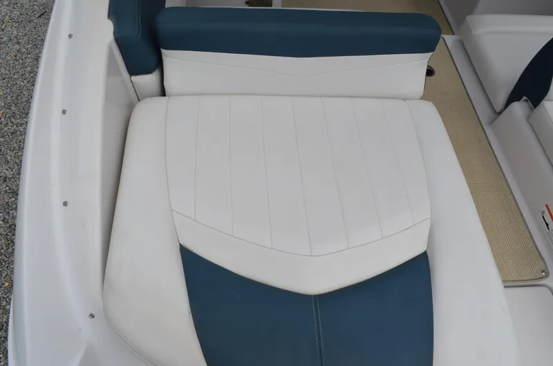 Slide: The Image of 2013 Four Winns H310 boat seating with white and blue upholstery. - 16