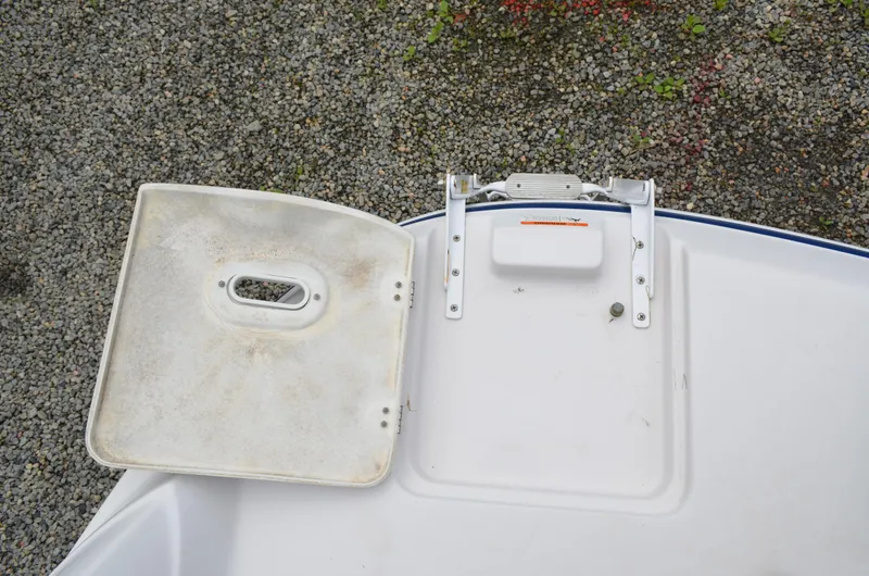 Slide: The Image of 2013 Four Winns H310 boat hatch and ladder on gravel background. - 18
