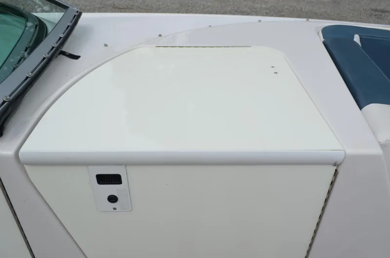 Slide: The Image of 2013 Four Winns H310 boat deck detail with storage compartment and seating. - 40
