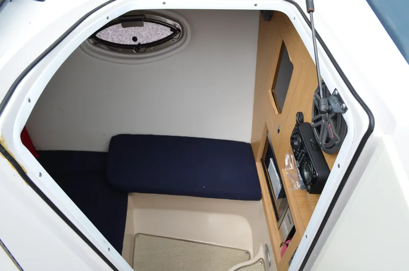 Slide: The Image of Interior cabin of 2013 Four Winns H310 boat with seating and control panel. - 42