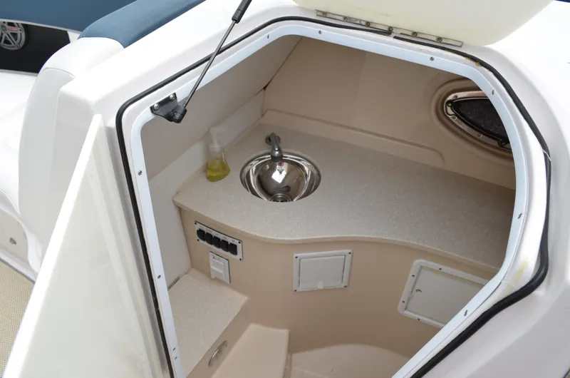 Slide: The Image of 2013 Four Winns H310 boat interior sink and counter area - 46