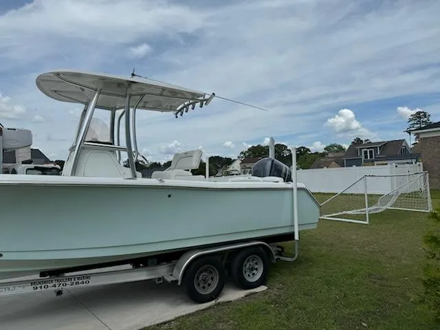 Slide: The Image of 2016 Sea Hunt Ultra 234 boat on trailer in residential yard. - 10