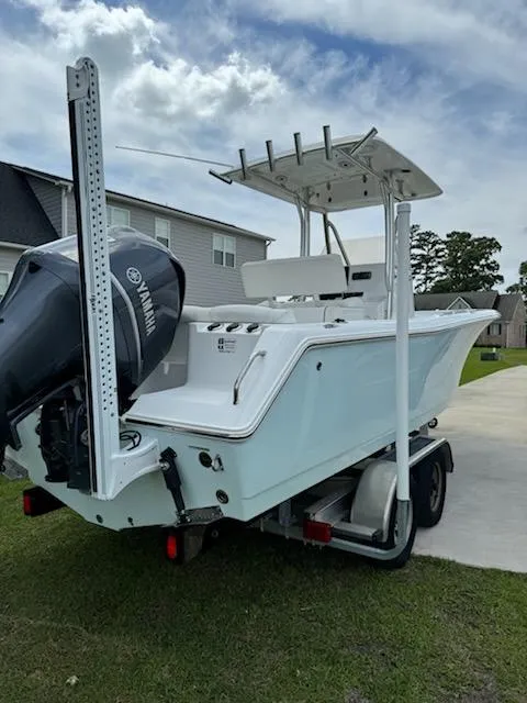 Slide: The Image of 2016 Sea Hunt Ultra 234 boat on trailer with Yamaha outboard motor. - 9