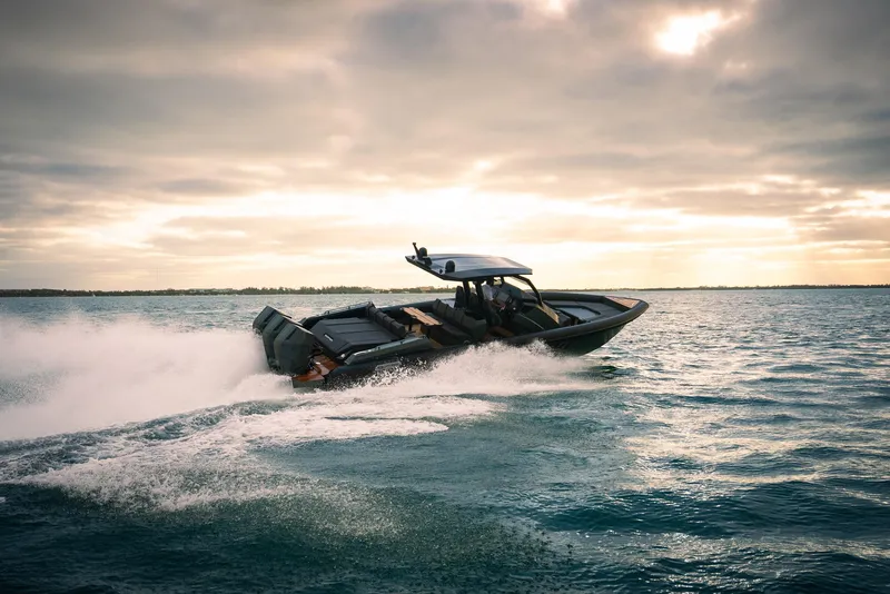 Slide: The Image of Skipper-BSK 42 boat cruising on open water at sunset, 2024 model. - 10