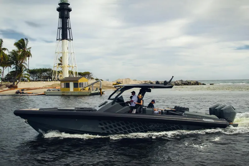 Slide: The Image of 2024 Skipper-BSK 42 boat cruising near a lighthouse on a cloudy day. - 2