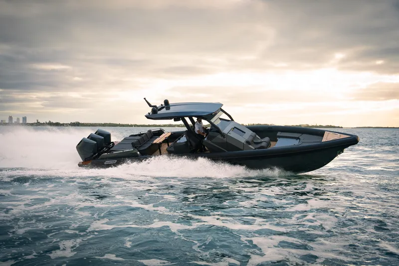 Slide: The Image of 2024 Skipper-BSK 42 boat cruising on open water at sunset. - 7