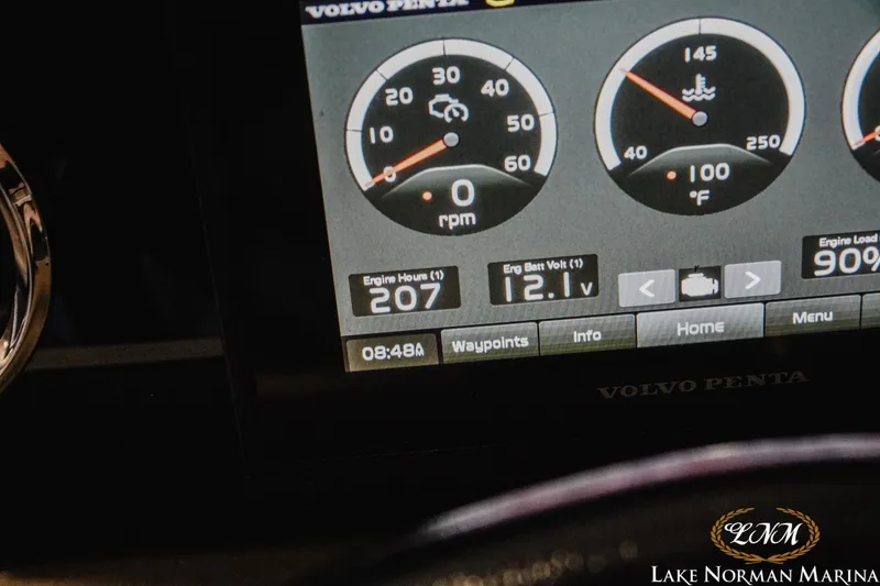 Slide: The Image of Close-up of 2022 Crownline 220 SS SURF dashboard displaying engine metrics. - 17
