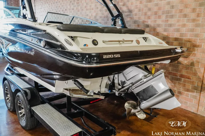 Slide: The Image of 2022 Crownline 220 SS SURF boat on trailer at Lake Norman Marina. - 5