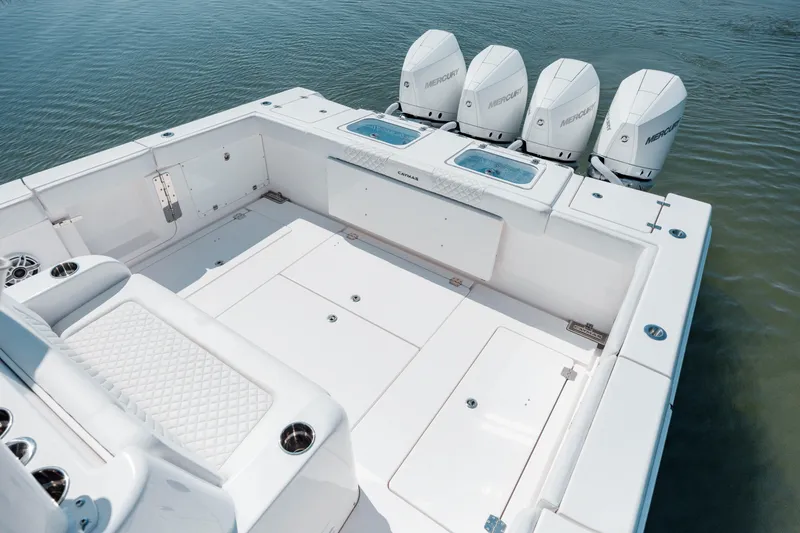 Slide: The Image of 2022 Caymas 401 CC boat with quad outboard engines and spacious deck. - 15