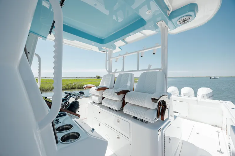 Slide: The Image of 2022 Caymas 401 CC boat interior with luxurious seating and ocean view. - 20