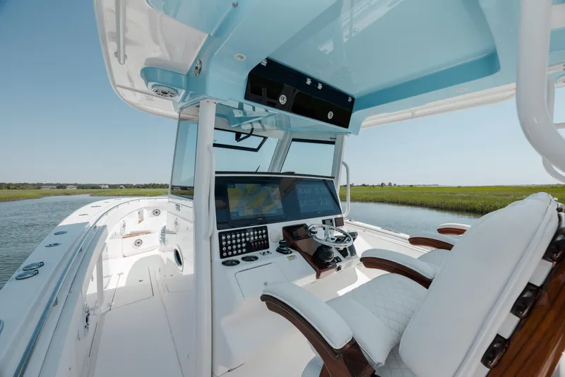 Slide: The Image of 2022 Caymas 401 CC boat cockpit with advanced navigation system. - 21