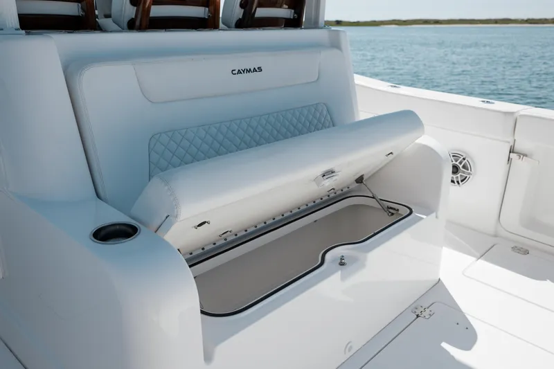 Slide: The Image of 2022 Caymas 401 CC boat with open storage compartment. - 29