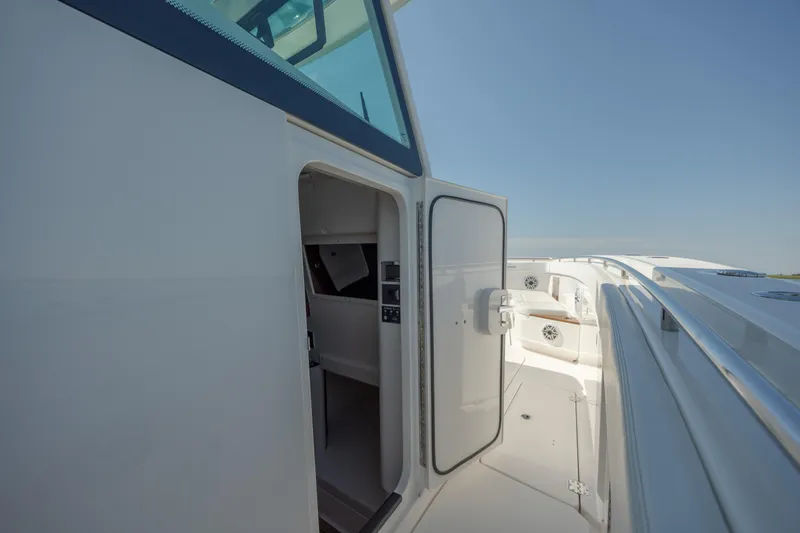 Slide: The Image of 2022 Caymas 401 CC boat interior cabin entrance with open door. - 30