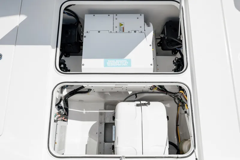 Slide: The Image of 2022 Caymas 401 CC boat engine compartment with electrical components. - 41