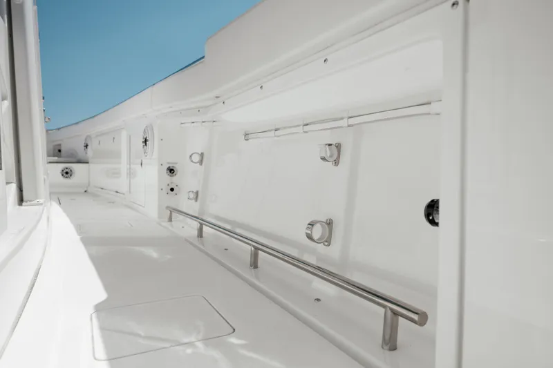 Slide: The Image of 2022 Caymas 401 CC boat interior with white finish and stainless steel rail. - 45