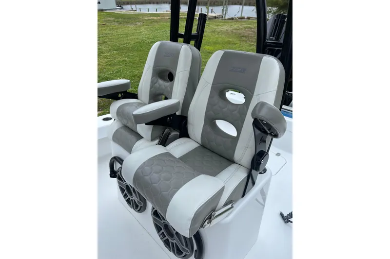 Slide: The Image of Luxury seating on 2021 ZCB 26 Freemason boat, featuring gray and white cushioned design. - 11