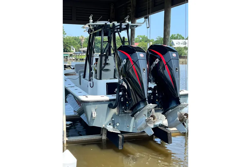 Slide: The Image of 2021 ZCB 26 Freemason boat with dual 300 horsepower engines docked. - 12