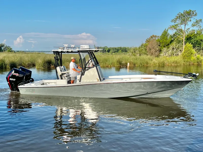 Slide: The Image of 2021 ZCB 26 Freemason boat cruising on a calm river. - 3