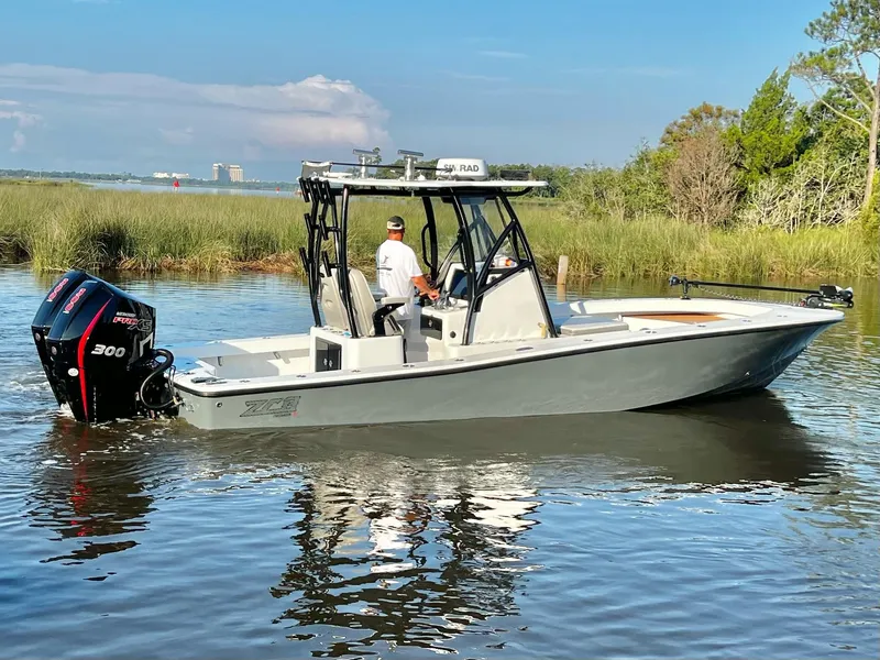 Slide: The Image of 2021 ZCB 26 Freemason boat cruising on a calm river. - 5