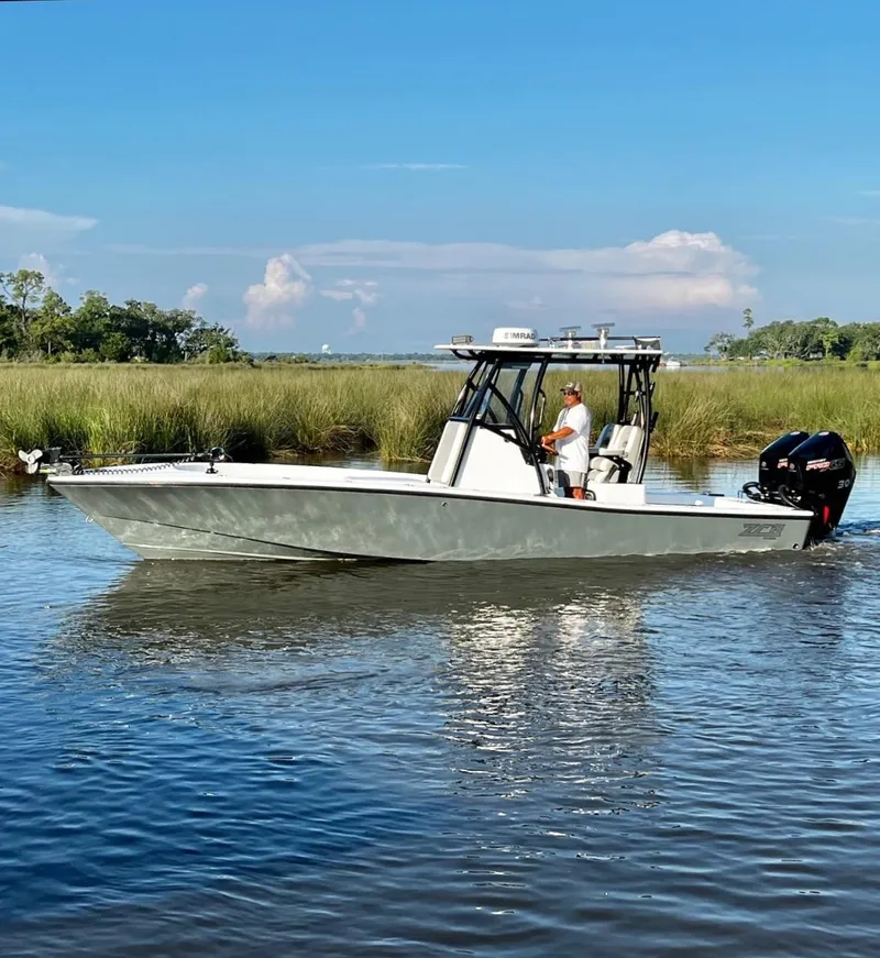 Slide: The Image of 2021 ZCB 26 Freemason boat cruising in a serene waterway. - 7