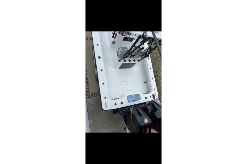 Slide: The Image of Top view of a 2021 ZCB 26 Freemason boat with fishing rod holders. - 8